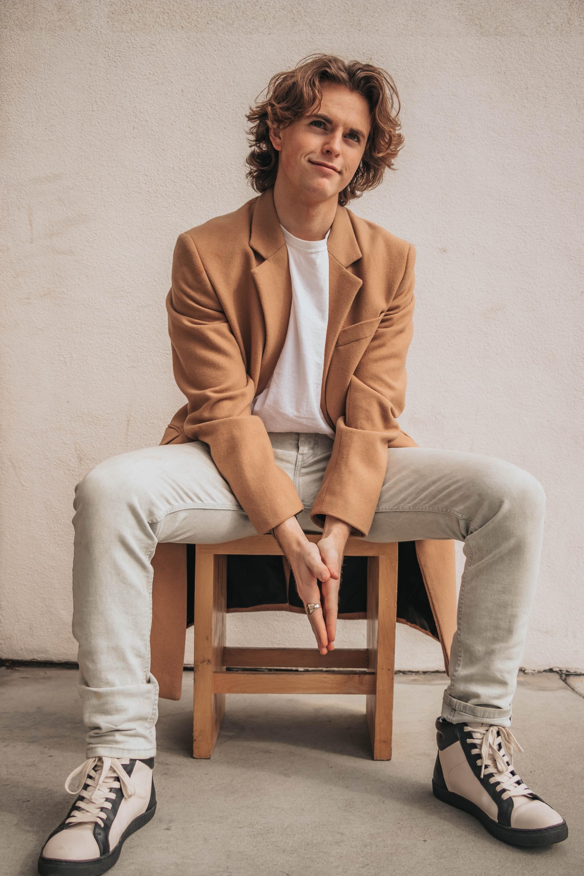 Editorial styling: camel tailoring and ivory trousers